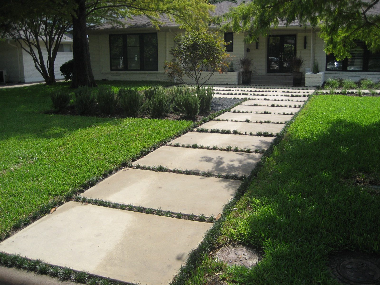Concrete stepping-stone walkway to suburban house